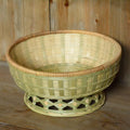 Handwoven natural bamboo storage basket showing three size variations