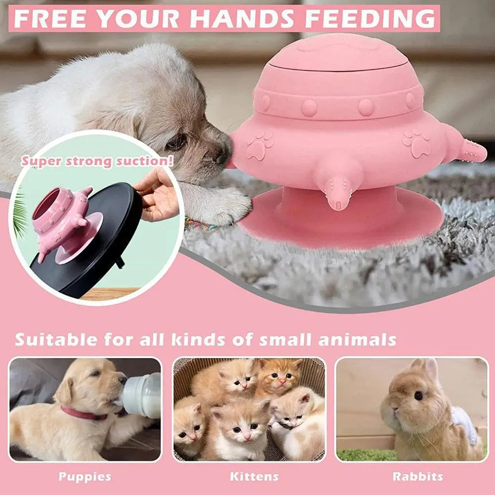 Pink silicone pet nursing bottle with bionic breast-shaped pacifier on a flat base, with three additional pacifiers.