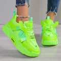 Women's platform sports sneakers in multiple colours with mesh upper and lace-up front.