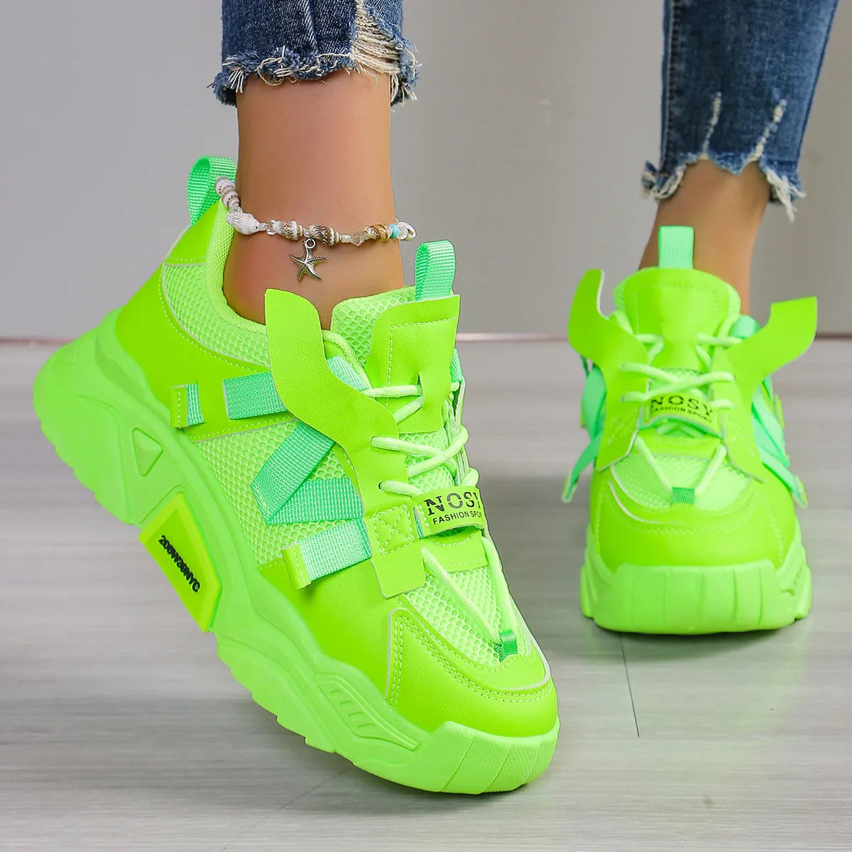 Women's platform sports sneakers in multiple colours with mesh upper and lace-up front.