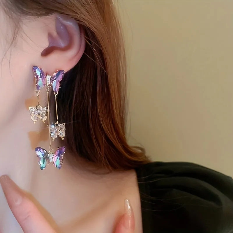 Electroplated blue purple butterfly tassel earrings with silver needle crystal flowers for women.