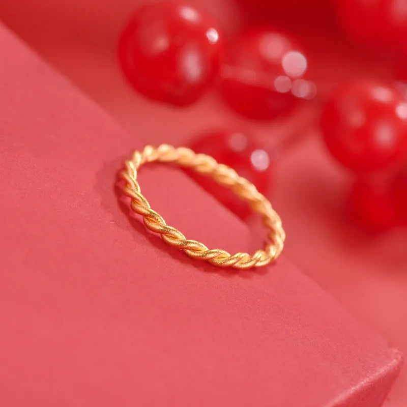 Simple bracelet brass gold plated ring in glossy finish on white background