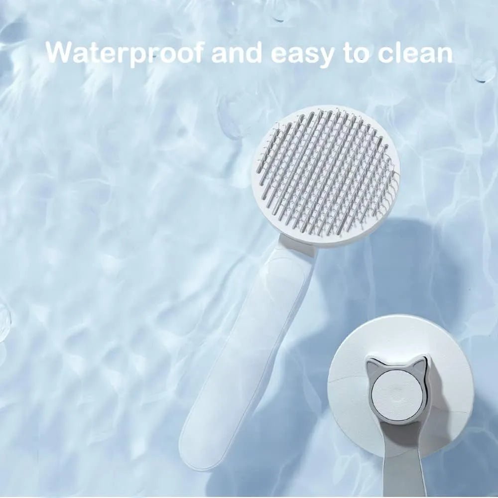 Blue self-cleaning pet grooming brush with round-tipped metal pins and a rubber handle.