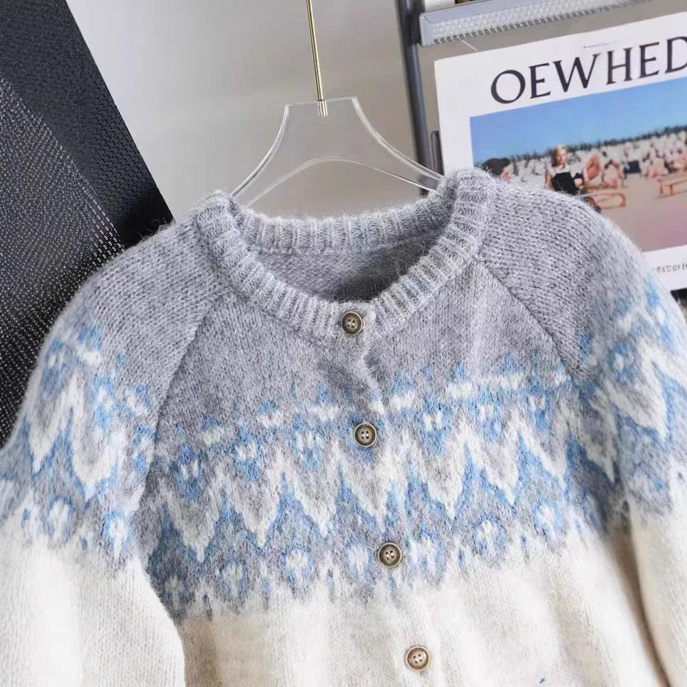 Women's loose-fit jacquard sweater coat in milky white, shown with long sleeves and a textured pattern.