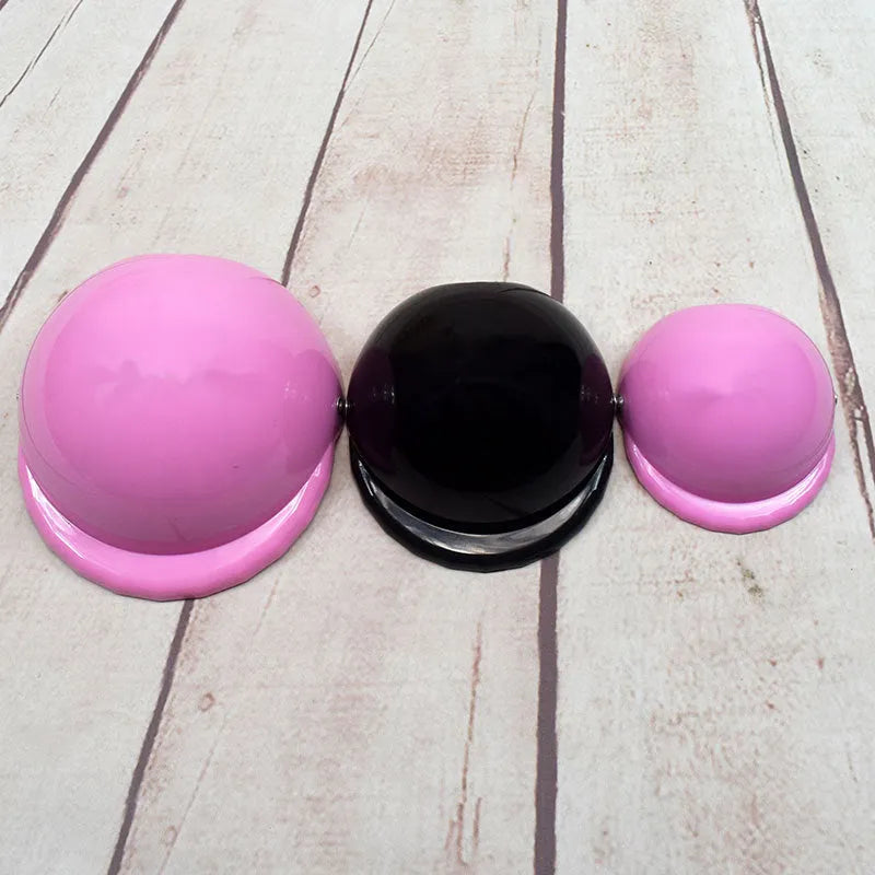 Plastic dog motorcycle helmet in pink colour showing solid design and structured form