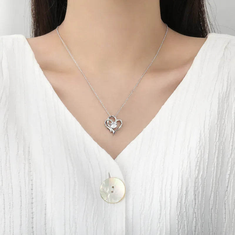 Women's sterling silver necklace with a heart-shaped pendant in rose gold, white gold, or yellow gold finish.