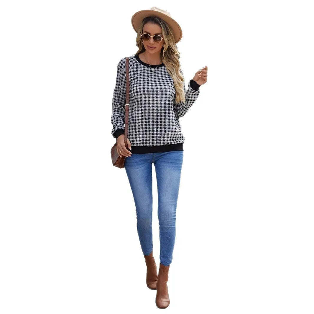 Black polyester pullover sweater with printed plaid pattern and long sleeves