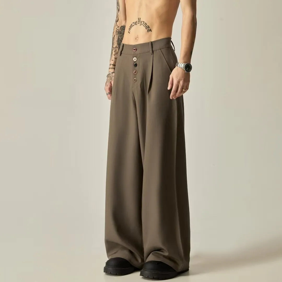 Men's solid black casual straight-leg trousers with a wide-leg fit and button fly on a neutral background.