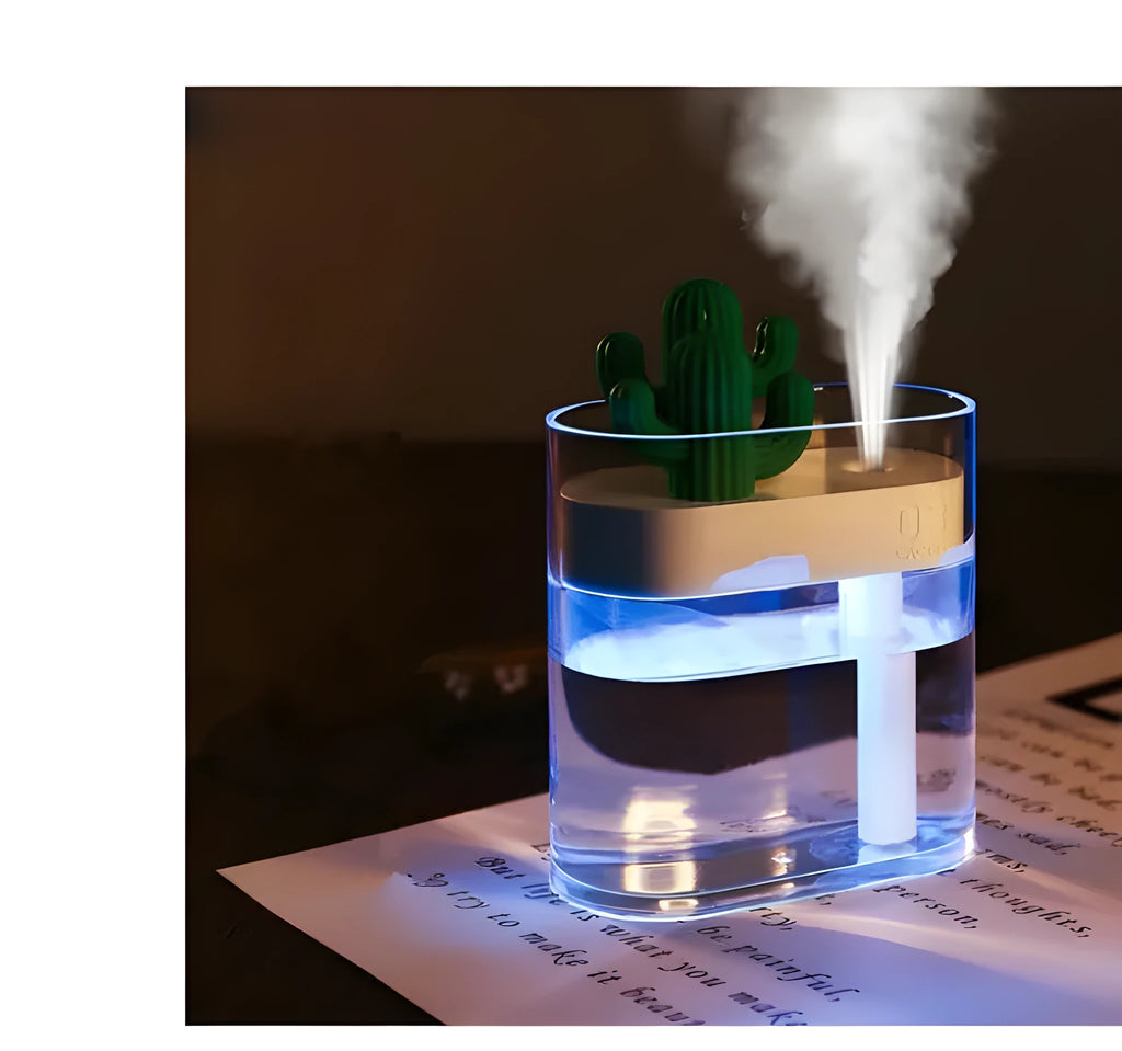 Transparent green cactus USB portable humidifier on desk showing water level inside plastic body