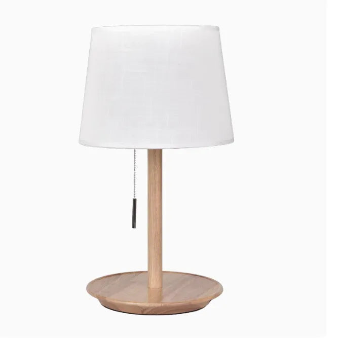 Walnut solid wood bedside lamp with cloth lampshade on wooden table