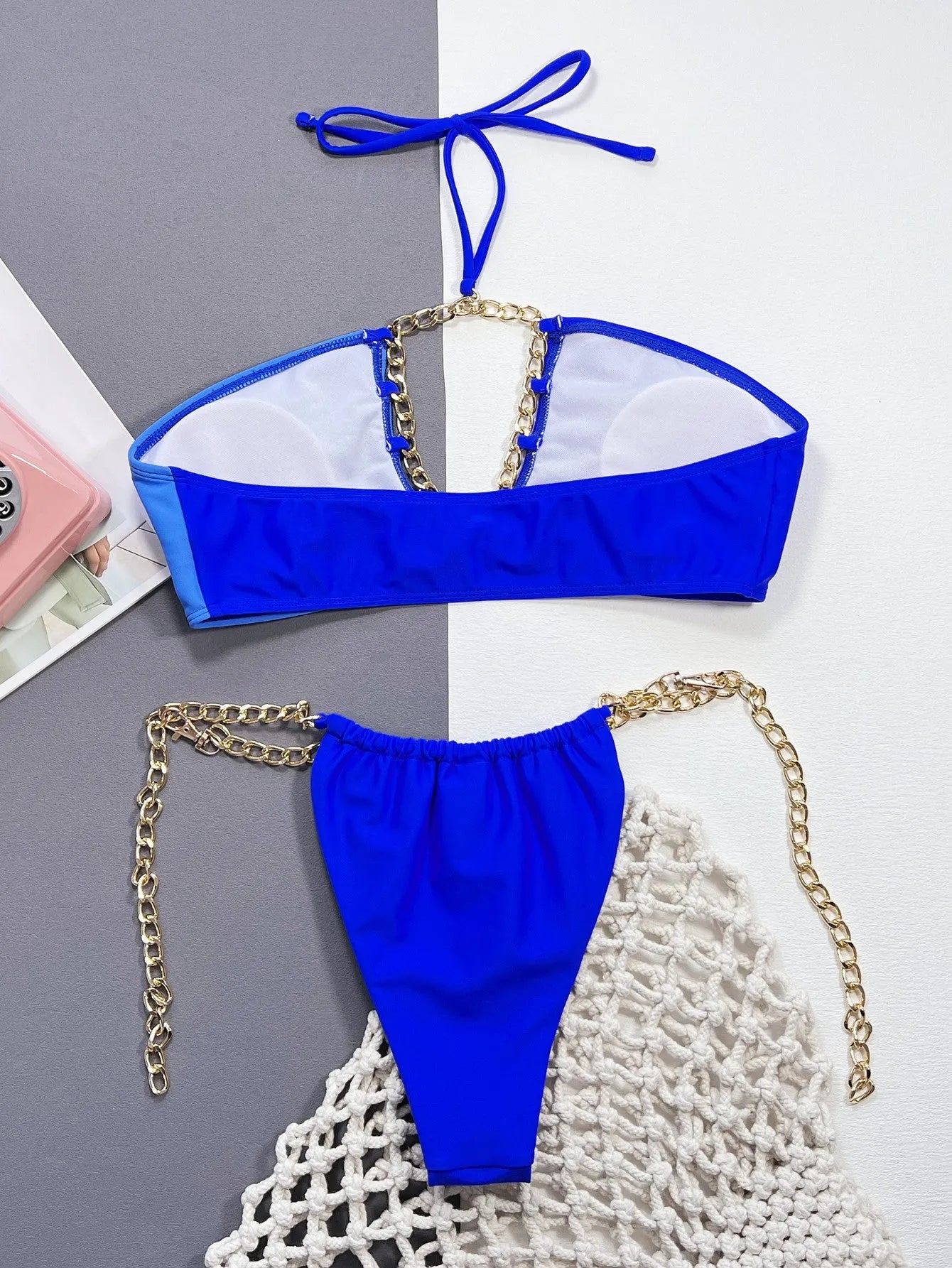 Women's blue nylon split bikini set top and bottom on display