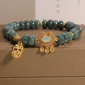 Natural emerald jade abacus bead safety lock style bracelet on women's wrist, alloy frame, green gemstone beads