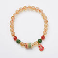 Citrine five sutra hand-woven crystal bracelet with geometric design on neutral background
