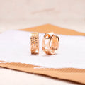 Rose gold hollowed-out heart-shaped circular earrings with electroplated finish
