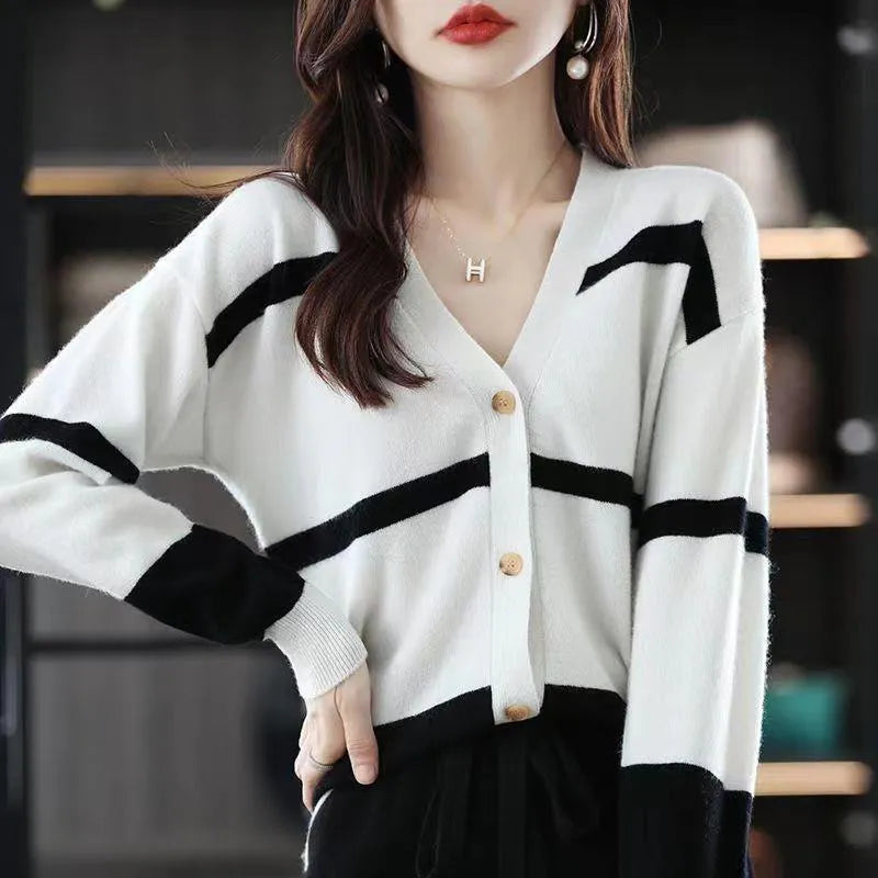 Women's striped V-neck knitted cardigan in a slim fit, showing 3D pattern detail.
