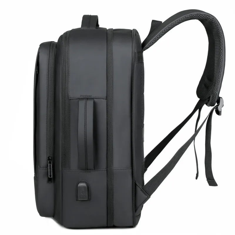 Black waterproof Oxford cloth business backpack with curved shoulder strap showing laptop compartment and 20-35L capacity.