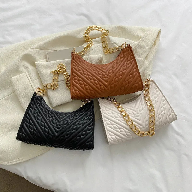 Pleated chain strap baguette shoulder bag in vertical square shape with soft PU leather exterior