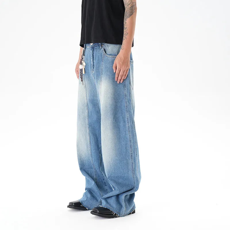 Light blue vintage washed wide leg machete jeans with zip fly on a model