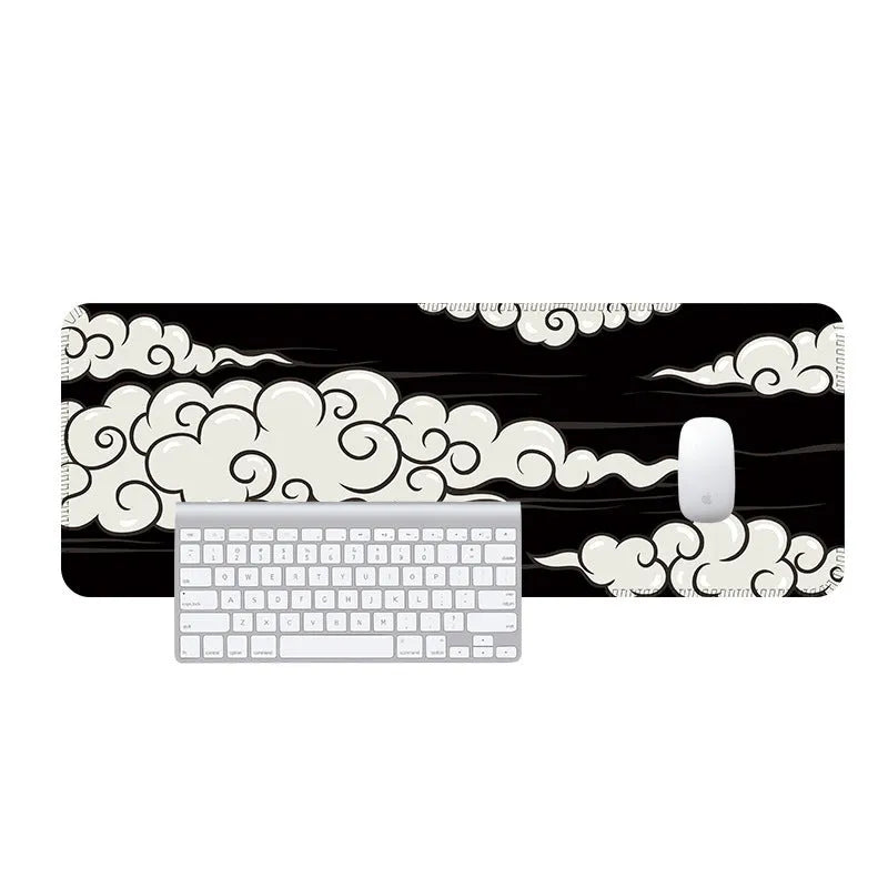 Large cloud pattern rubber desk mat and mouse pad on a wooden desk