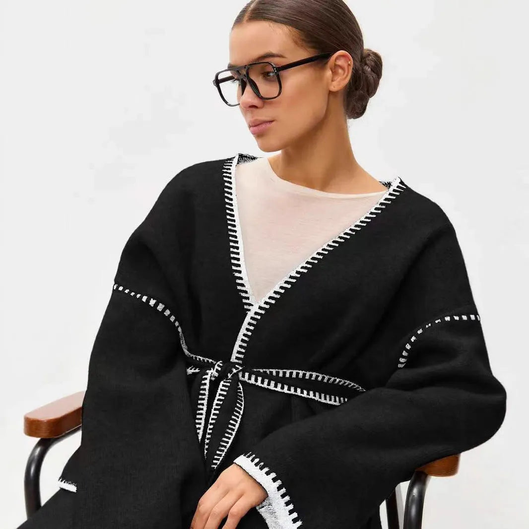 Lace-up front knitted cardigan in a loose fit, shown in black, camel, and white colour options.