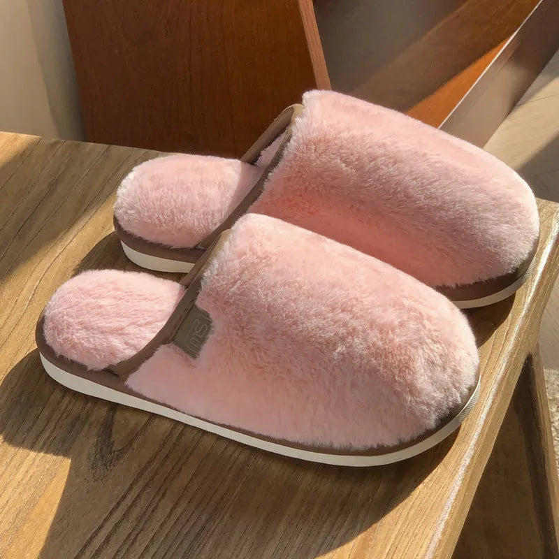 Unisex solid colour plush slippers with non-slip PVC soles and car stitching detail