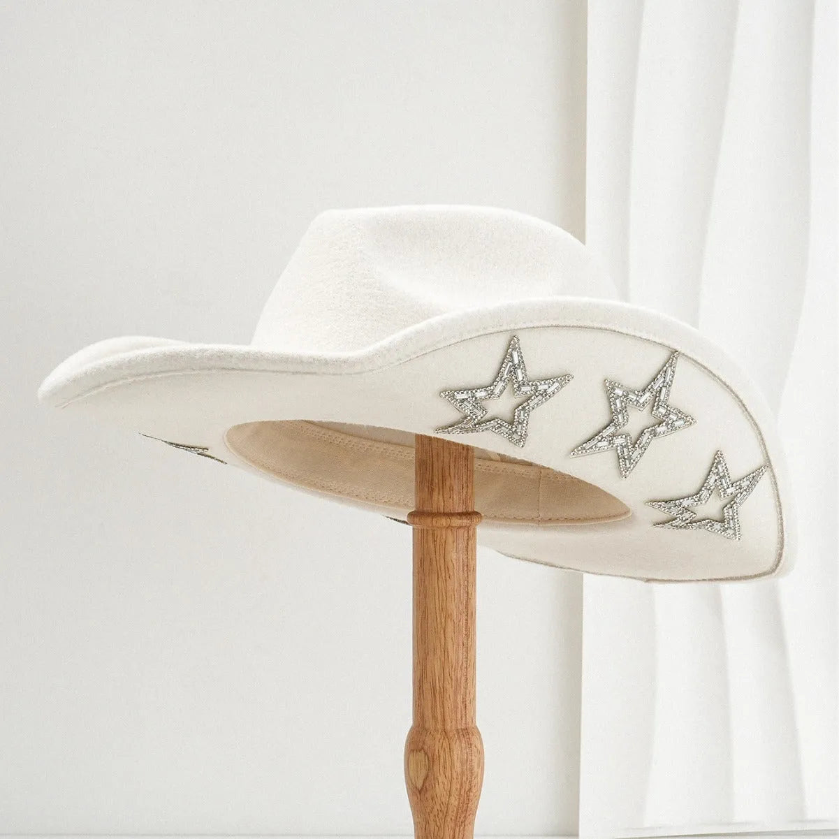 Polyester western top hat with conical crown and hexagonal star detail in size M.