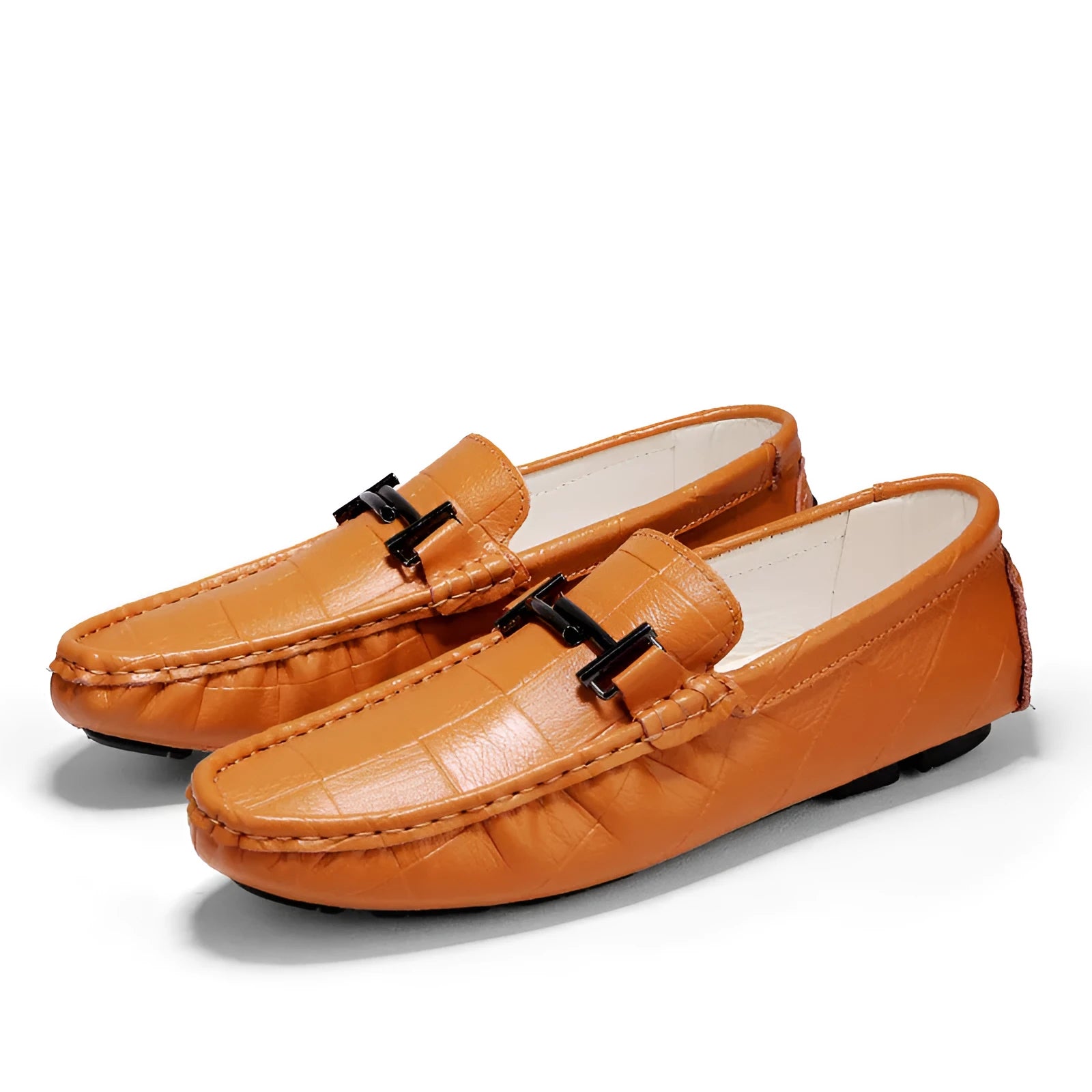 Men's black leather slip-on loafers with a belt buckle strap and flat rubber sole