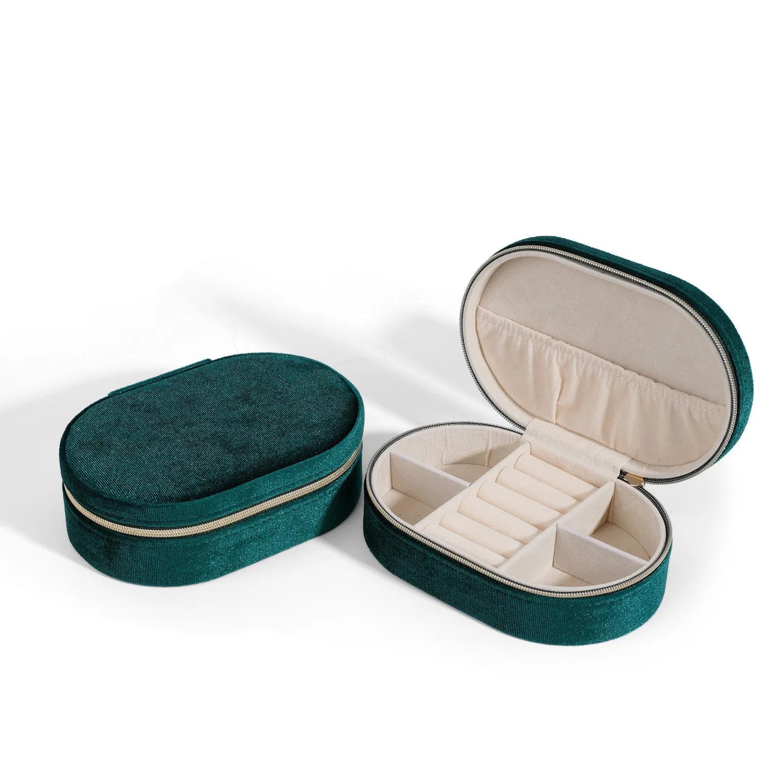 Oval velvet jewellery box in lake blue colour with flannel interior, shown with rings inside.