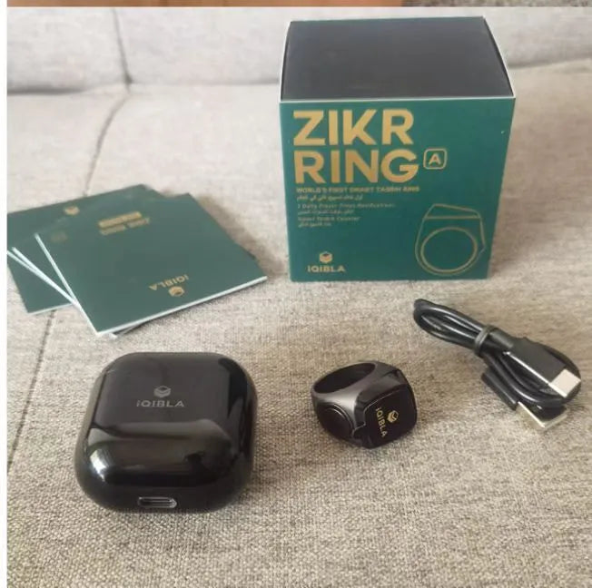 Zikr1 silver metal smart ring for Tasbih counting on a finger, showing its OLED display and single button.