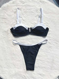 Low waist black women's bikini bottoms with stitching split, nylon spandex, front view