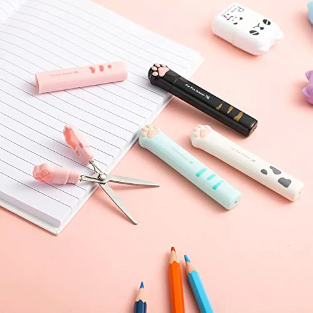 Small folding scissors with cat paw design on handles in choice of four colours, shown with blades safely closed.
