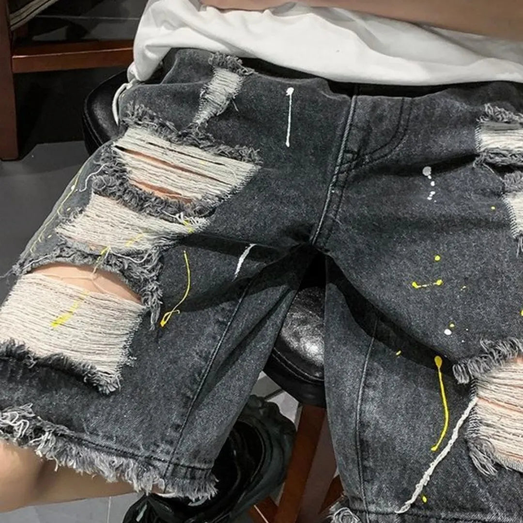 Men's distressed denim shorts with holes in light blue colour, loose fit above knee length