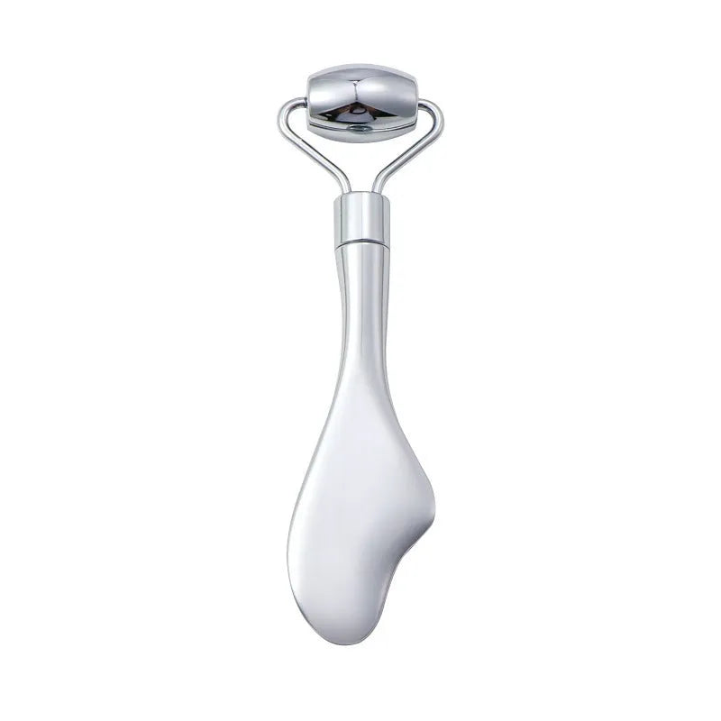 Stainless steel facial massage board set with heart-shaped eye roller and scraping plate on simple packaging