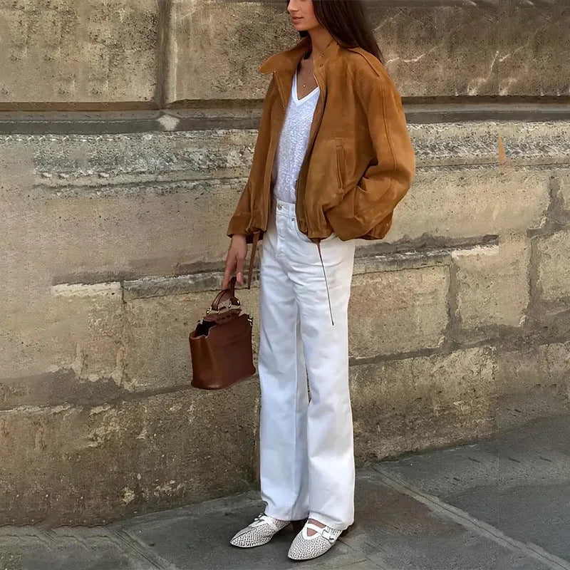 Loose-fit solid colour polyester jacket with long sleeves on a model.