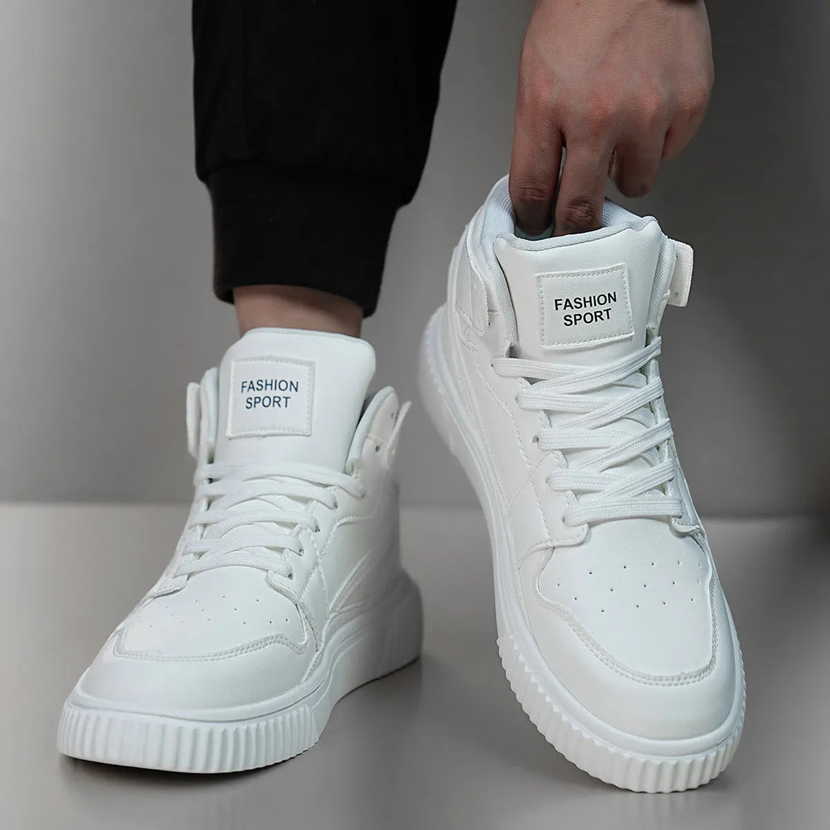 Men's white lace-up casual trainers with a microfiber upper and round toe on a plain background.