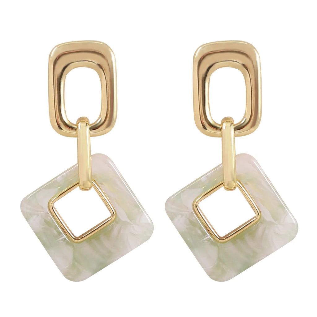 Copper hollow geometric square earrings with electroplated finish, chamfered corners, and two colour options