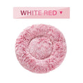 Fluffy donut-shaped dog bed in long plush fabric, shown in a light grey colour without a zipper.