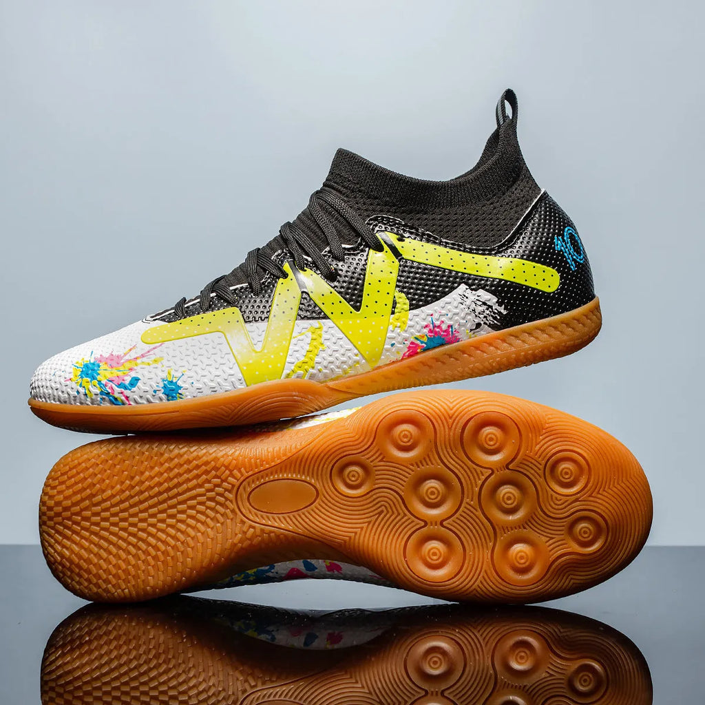Adult low-top football boots with a PVC upper and rubber studded outsole, shown in black and yellow.