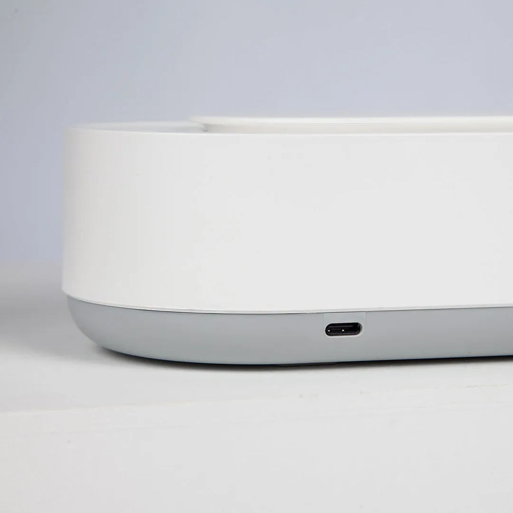 White portable ultrasonic cleaning machine with touch button and stainless steel tank.