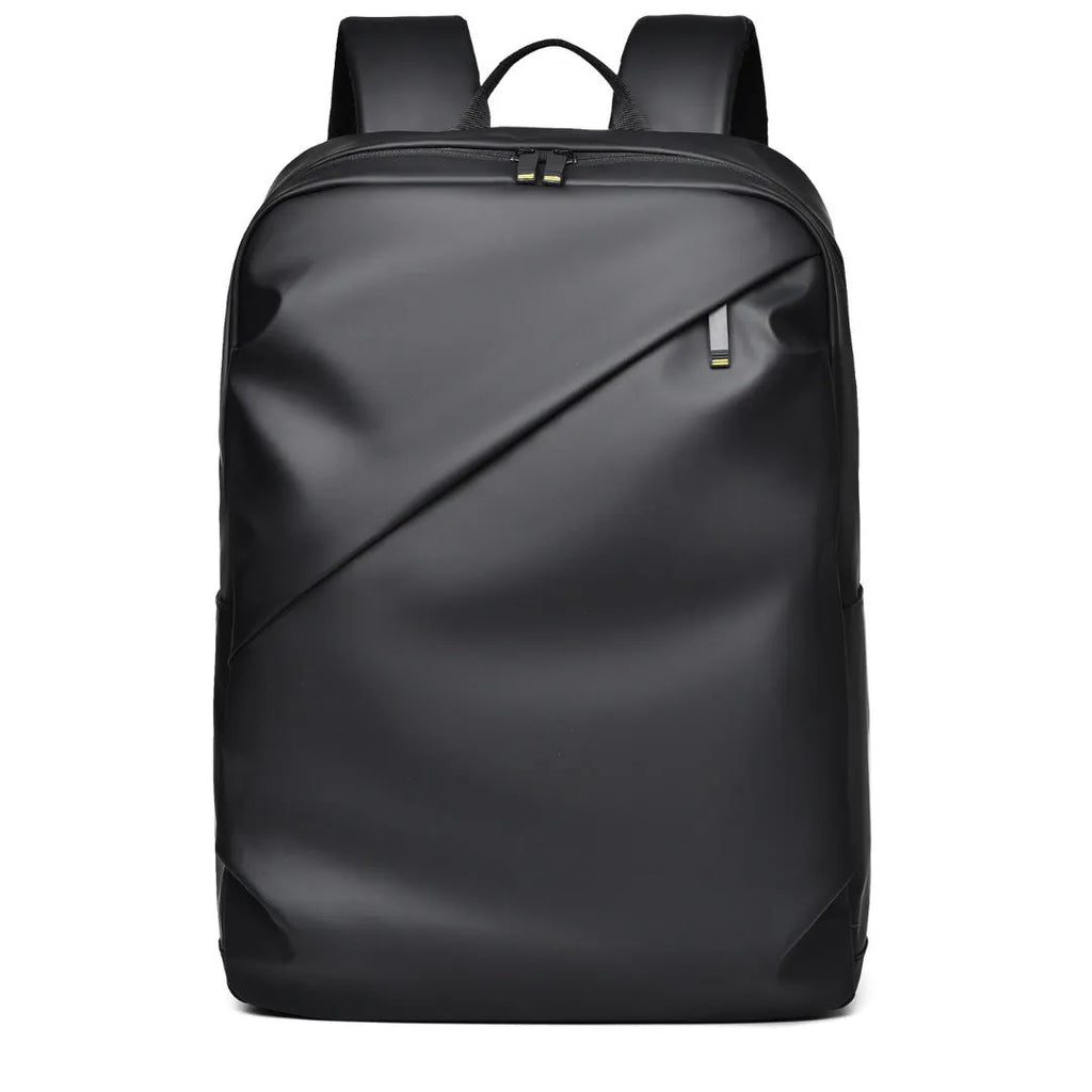 Large simple design waterproof backpack in grey with visible stitching, shown with a separate computer bag.