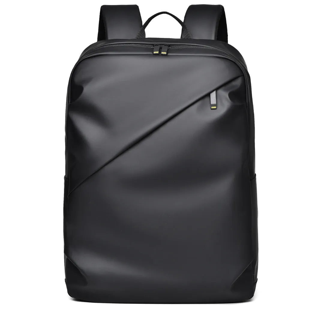 Large simple design waterproof backpack in grey with visible stitching, shown with a separate computer bag.