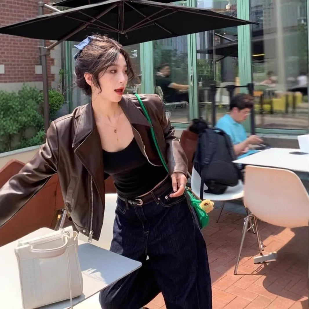 Women's brown retro imitation leather jacket with long sleeves and pocket details, slim fit.