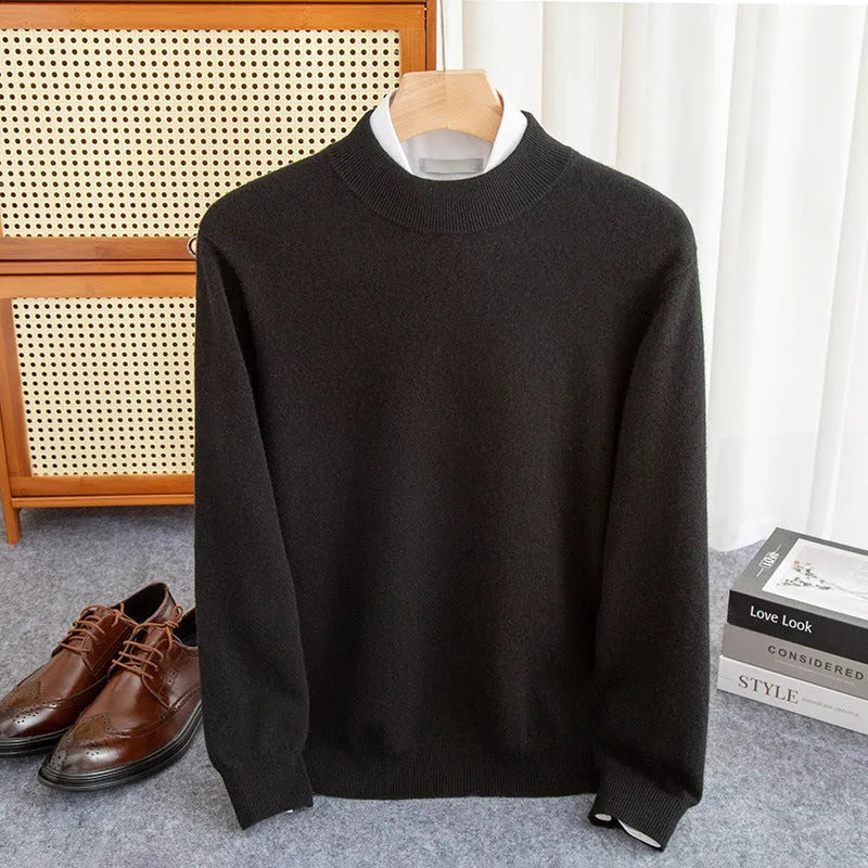 Man wearing a loose-fit half-collar wool sweater in a neutral colour, showing the knit texture and regular sleeve design.