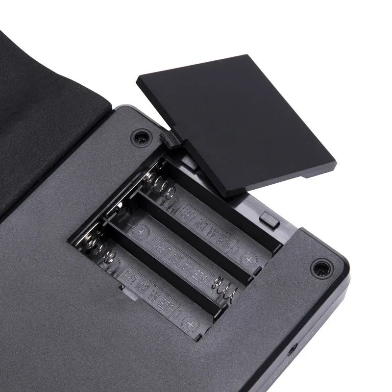 Portable folding 49-key electronic keyboard with built-in speaker in gloss black colour