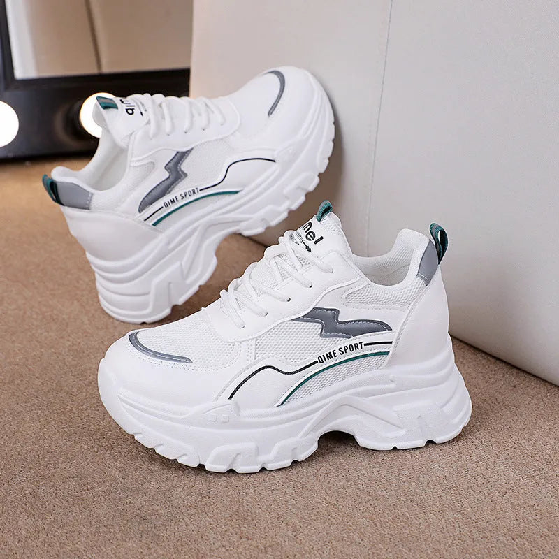 Women's white and beige breathable dad shoes with cross shoulder straps and a lace-up front.
