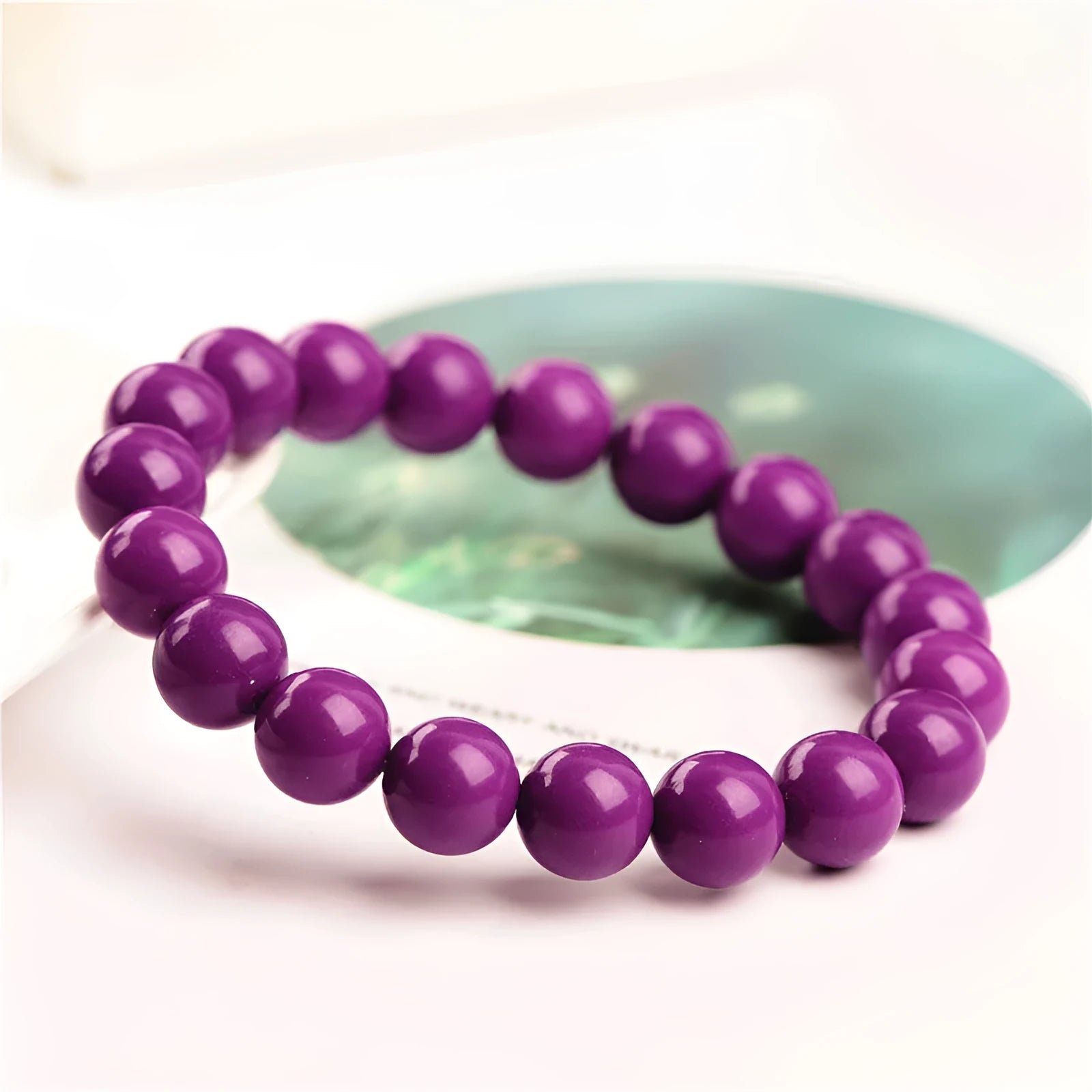 Jiuya polished purple mica crystal bracelet shown in single circle design on a wrist.