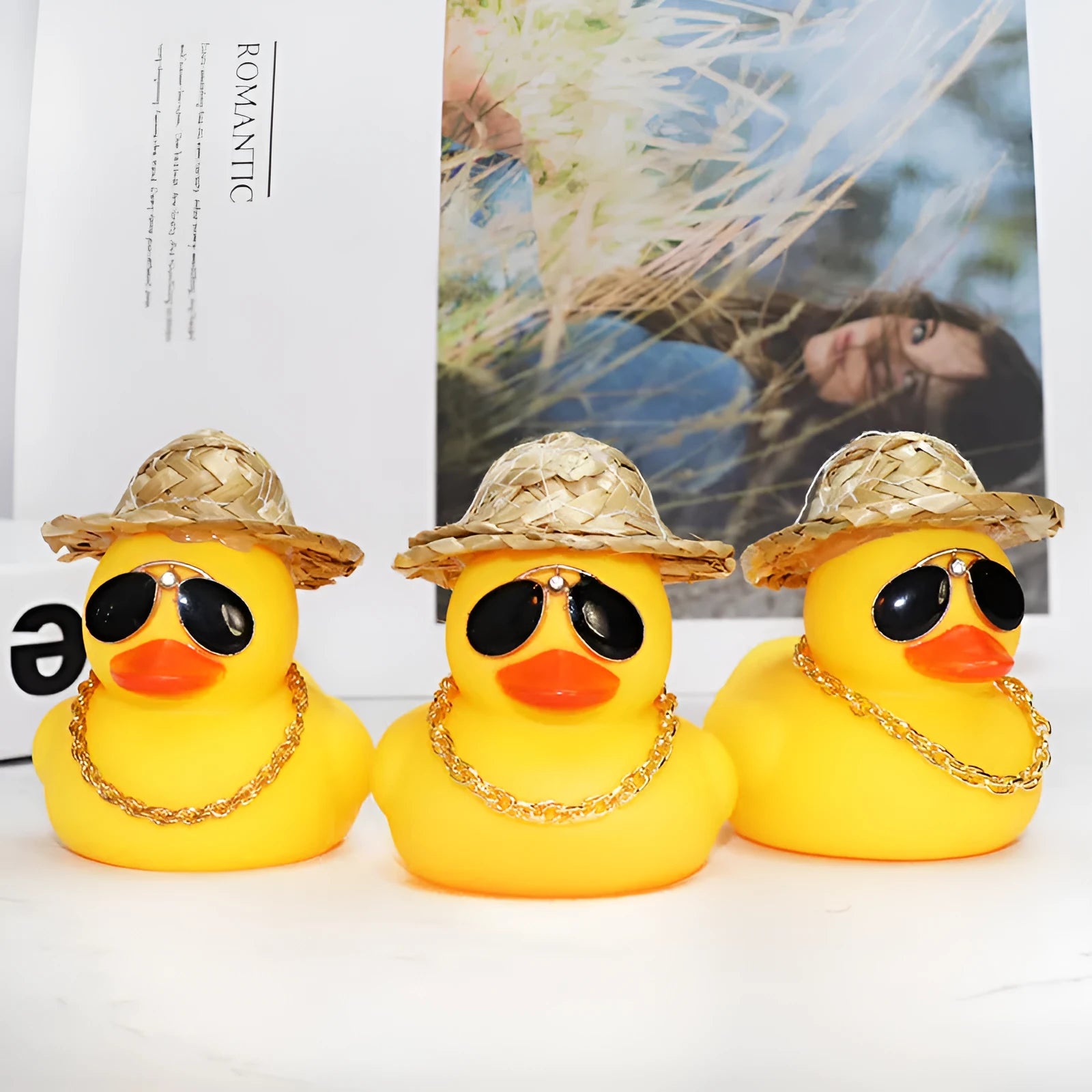 Yellow cartoon duck with straw hat car dashboard ornament on adhesive base with sunglasses necklace
