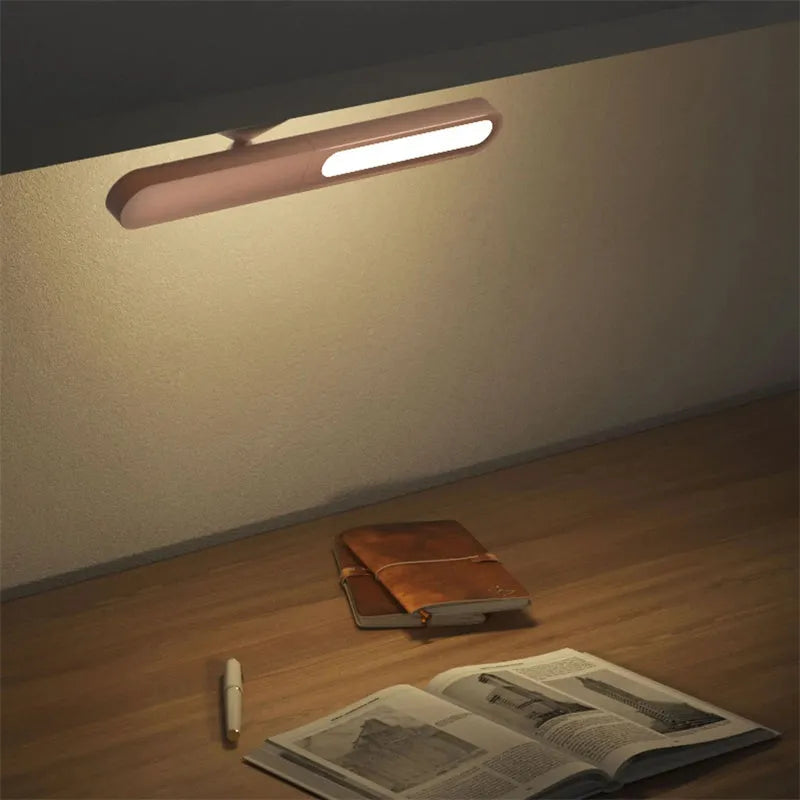 Geometric creative desk lamp with magnetic base shown in white on a desk.