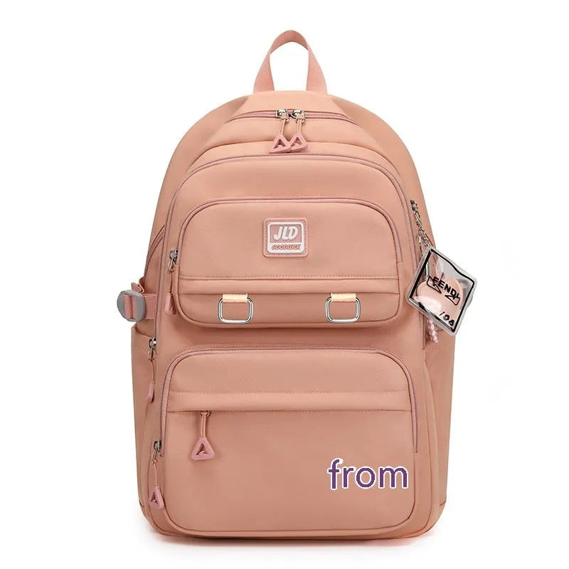Girls' large nylon school backpack in a choice of colours and patterns including geometric graffiti and solid purple.