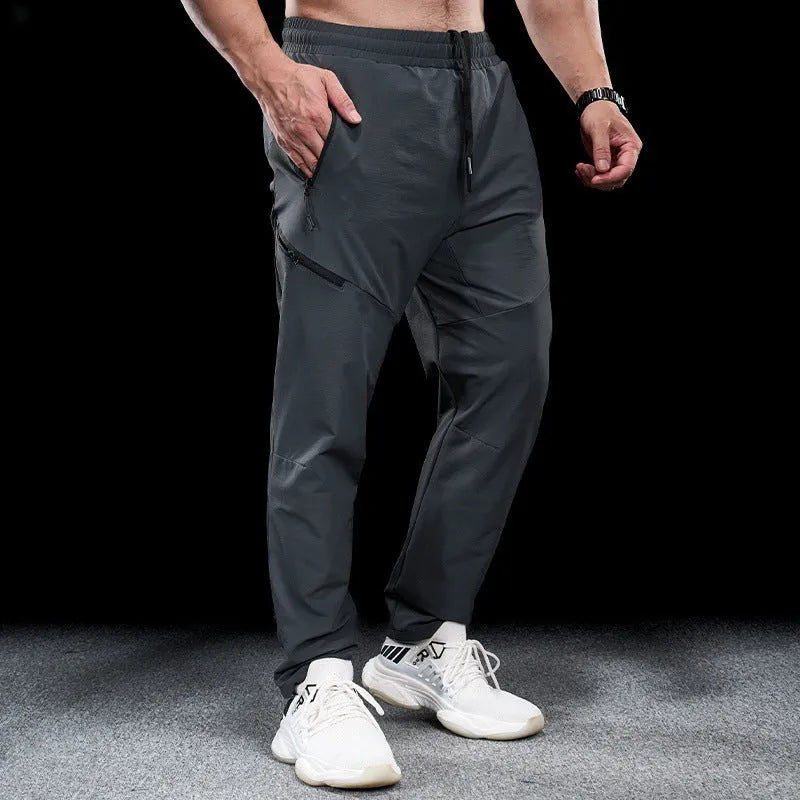 Men's waterproof quick-dry workout trousers in nylon fabric showing colour options